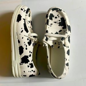 Cowprint slip on shoes